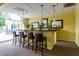 Stylish bar area with pendant lighting, mirrors and bar seating open to outdoor seating at 2479 Peachtree Ne Rd # 104, Atlanta, GA 30305