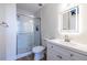 Modern bathroom with an illuminated mirror, vanity with sink, and glass-enclosed shower at 2479 Peachtree Ne Rd # 104, Atlanta, GA 30305