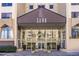 Elegant building entrance with lush landscaping and decorative planters, providing a welcoming first impression at 2479 Peachtree Ne Rd # 104, Atlanta, GA 30305