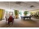 Large community room with game table, billiard table and wet bar leads to the outdoor patio at 2479 Peachtree Ne Rd # 104, Atlanta, GA 30305