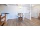 Cozy dining area features wood floors, chandelier, and bright white walls at 2479 Peachtree Ne Rd # 104, Atlanta, GA 30305