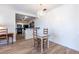 Cozy dining area adjacent to kitchen, features wood floors and chandelier at 2479 Peachtree Ne Rd # 104, Atlanta, GA 30305
