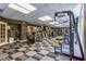 Modern fitness center with a variety of exercise machines, treadmills and large windows at 2479 Peachtree Ne Rd # 104, Atlanta, GA 30305