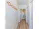 Hallway features wood floors, a coat rack, and access to a bathroom with a glass-enclosed shower at 2479 Peachtree Ne Rd # 104, Atlanta, GA 30305