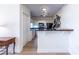 Modern kitchen adjacent to dining area, features white cabinets and black appliances at 2479 Peachtree Ne Rd # 104, Atlanta, GA 30305