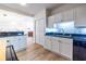 Modern kitchen with bright cabinets, stainless steel appliances and black countertops at 2479 Peachtree Ne Rd # 104, Atlanta, GA 30305