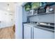 Bright laundry room showcasing a washer and dryer, as well as wire shelving for storage at 2479 Peachtree Ne Rd # 104, Atlanta, GA 30305