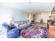 Bright living room and dining area with neutral paint, wood-look floors, and comfortable furnishings at 2479 Peachtree Ne Rd # 104, Atlanta, GA 30305