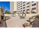 Spacious patio area including an outdoor grill, seating arrangements, and decorative planters at 2479 Peachtree Ne Rd # 104, Atlanta, GA 30305