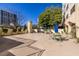 Picturesque patio area providing outdoor seating, lush foliage, and barbecue facilities at 2479 Peachtree Ne Rd # 104, Atlanta, GA 30305