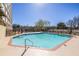 Outdoor pool featuring a relaxing area surrounded by landscaping and residential buildings at 2479 Peachtree Ne Rd # 104, Atlanta, GA 30305