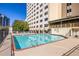 Outdoor pool showcasing clear water, a sundeck, and nearby residential buildings at 2479 Peachtree Ne Rd # 104, Atlanta, GA 30305