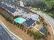 Community clubhouse with pool set amidst trees, offering residents leisure and recreation at 3030 Westpoint Cir, Snellville, GA 30078