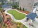 Landscaped backyard with patios, lush grass, and manicured gardens perfect for outdoor living at 3030 Westpoint Cir, Snellville, GA 30078