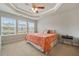 Bright bedroom features an elegant tray ceiling and lots of natural light from large windows at 3030 Westpoint Cir, Snellville, GA 30078
