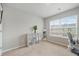 This bedroom features a big window for natural light and neutral colors at 3030 Westpoint Cir, Snellville, GA 30078