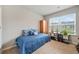 Well lit bedroom features a large window and closet at 3030 Westpoint Cir, Snellville, GA 30078