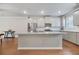 Modern kitchen with granite countertops, stainless steel appliances, and ample cabinet storage space at 3030 Westpoint Cir, Snellville, GA 30078