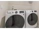 Laundry room with new, front-loading washer and dryer, offering convenience and efficiency at 3030 Westpoint Cir, Snellville, GA 30078