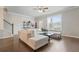 Bright living room with hardwood floors, a sectional couch, and natural light from a large window at 3030 Westpoint Cir, Snellville, GA 30078