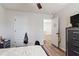 Bedroom with wood-look flooring, neutral paint and a ceiling fan at 3040 Westgate Park Dr, Loganville, GA 30052