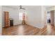 Spare bedroom featuring wood floors, neutral decor and a view of the outdoors at 3040 Westgate Park Dr, Loganville, GA 30052