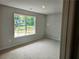 Bedroom with a large window that provides lots of natural light at 305 Melanie Ct, Bowdon, GA 30108