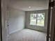 Bedroom featuring a large window and neutral walls, ready for personalization at 305 Melanie Ct, Bowdon, GA 30108