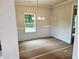 Dining room featuring chair rail and space for future residents to make their own at 305 Melanie Ct, Bowdon, GA 30108