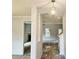 Bright entryway featuring a decorative light fixture and views into the living room and dining area at 305 Melanie Ct, Bowdon, GA 30108