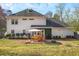 This large backyard features a stone patio and green space at 1011 Dogwood Forest Ne Dr, Marietta, GA 30068