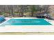 Large, covered community pool surrounded by lush trees at 1011 Dogwood Forest Ne Dr, Marietta, GA 30068