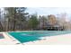 Spacious community pool area, surrounded by mature trees and a covered picnic area at 1011 Dogwood Forest Ne Dr, Marietta, GA 30068