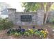 Community sign for Mitsy Forest, surrounded by colorful flowers and lush greenery at 1011 Dogwood Forest Ne Dr, Marietta, GA 30068
