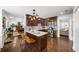 Updated kitchen features dark wood cabinets, stainless appliances, and an eat-in bar at 1011 Dogwood Forest Ne Dr, Marietta, GA 30068