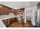 Beautiful kitchen with stainless steel appliances, hardwood floors and dark wood cabinets at 1011 Dogwood Forest Ne Dr, Marietta, GA 30068