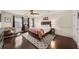 Serene main bedroom with hardwood floors, ample natural light, and a comfortable bed at 1011 Dogwood Forest Ne Dr, Marietta, GA 30068