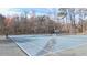 Community tennis courts with lush trees in the background at 1011 Dogwood Forest Ne Dr, Marietta, GA 30068