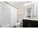 Bathroom featuring a shower-tub combination, black vanity, and tile flooring at 269 Castleberry Station Dr, Atlanta, GA 30313