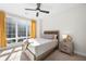Bedroom with a large window providing ample natural light, complemented by a modern ceiling fan at 269 Castleberry Station Dr, Atlanta, GA 30313
