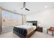 A modern bedroom features a unique leather bed frame and bright natural lighting from a large window at 269 Castleberry Station Dr, Atlanta, GA 30313