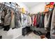 Walk-in closet with ample storage and organization with floor-to-ceiling shelving and hanging racks at 269 Castleberry Station Dr, Atlanta, GA 30313