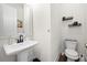 Modern powder room featuring pedestal sink and sleek fixtures, offering a clean and minimalist design at 269 Castleberry Station Dr, Atlanta, GA 30313