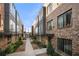 Beautiful brick townhomes with modern architectural details and lush landscaping at 269 Castleberry Station Dr, Atlanta, GA 30313