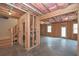 Large unfinished basement with exposed framing, insulation, concrete floor, and a stairway at 2960 Fareed St, Douglasville, GA 30135