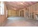 Spacious unfinished basement shows the framing, electrical panel, concrete floor and insulation at 2960 Fareed St, Douglasville, GA 30135