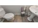 Bathroom featuring a pedestal sink and modern toilet at 2960 Fareed St, Douglasville, GA 30135