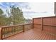Spacious wooden deck with stained railings and a tall privacy fence at 2960 Fareed St, Douglasville, GA 30135