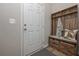 Cozy entryway with wooden storage bench, hooks, and drawers at 2960 Fareed St, Douglasville, GA 30135