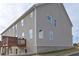 Rear exterior view of two-story home with a wooden deck at 2960 Fareed St, Douglasville, GA 30135